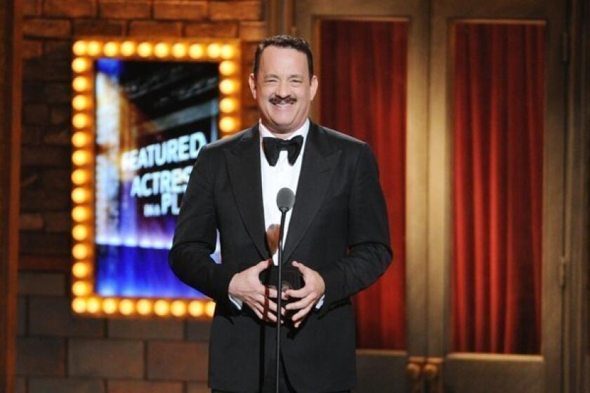 Tom Hanks, who later lost in his category, presents the Tony for actress in a featured role.