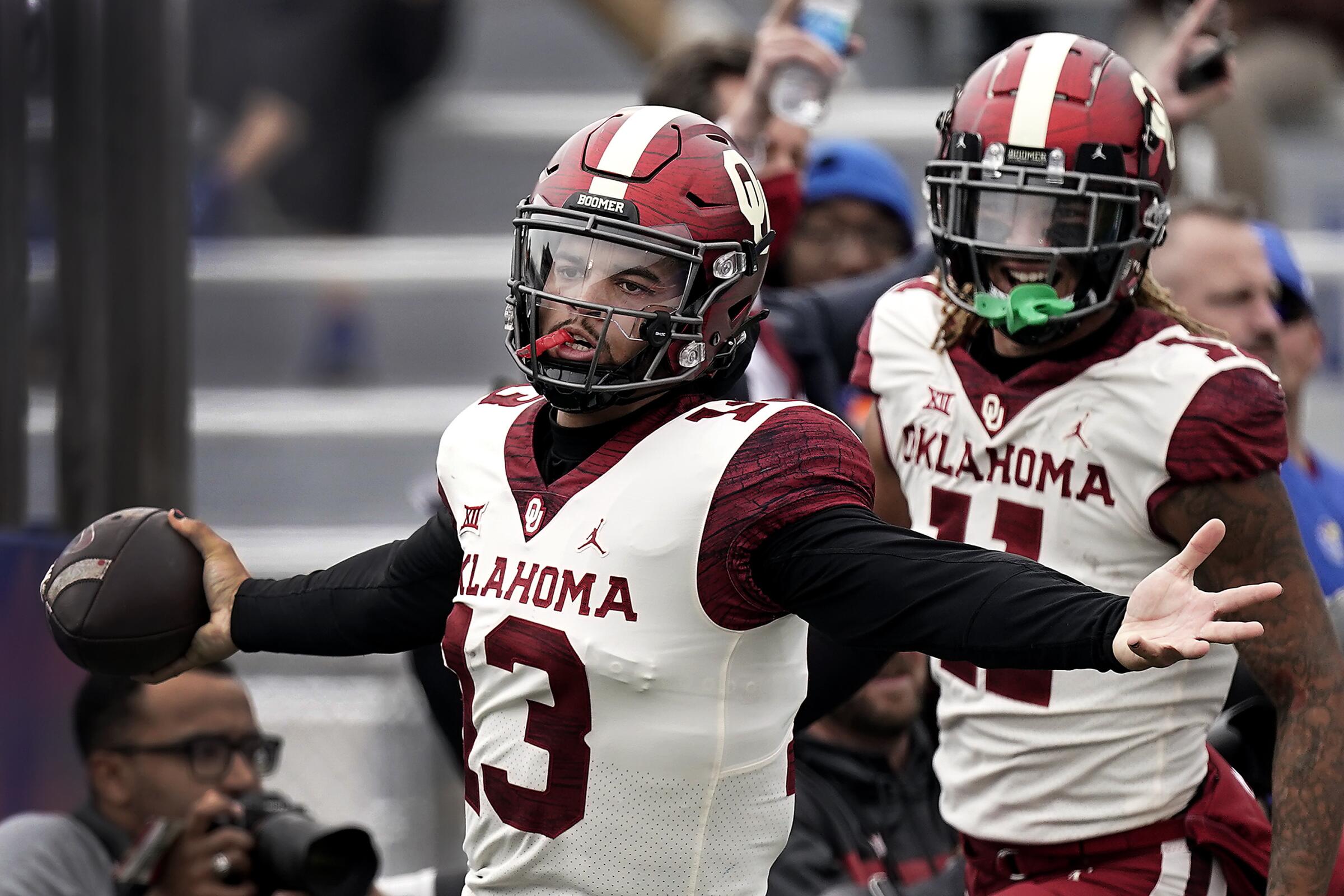 Oklahoma quarterback Caleb Williams (13) celebrates after running 40 yards to score a touchdown.