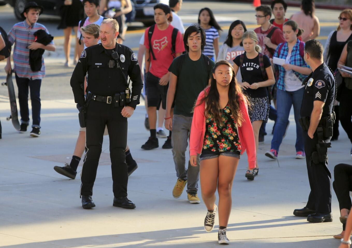 Students arrive for the first day of school at South Pasadena High School and are greeted by an increased police presence.
