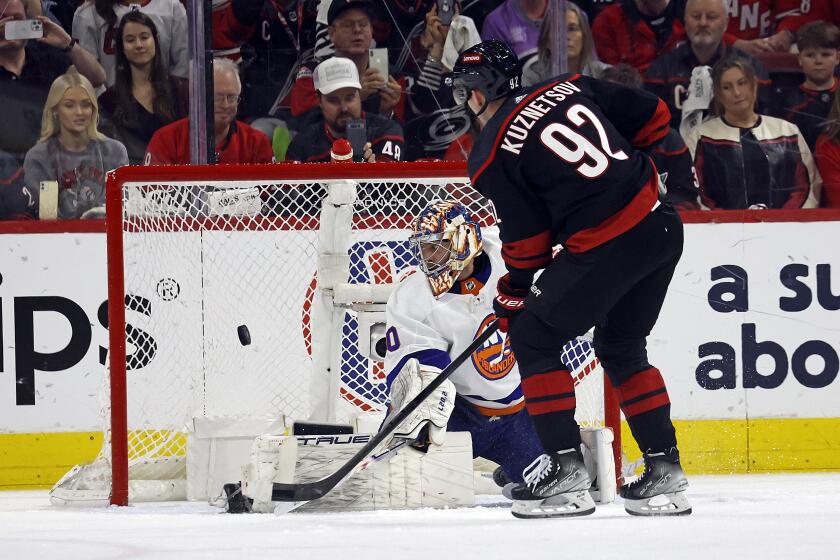 Carolina Hurricanes' Evgeny Kuznetsov (92) shoots a penalty shot puck past New York Islanders goaltender Semyon Varlamov (40) during the first period in Game 5 of an NHL hockey Stanley Cup first-round playoff series in Raleigh, N.C., Tuesday, April 30, 2024. (AP Photo/Karl B DeBlaker)