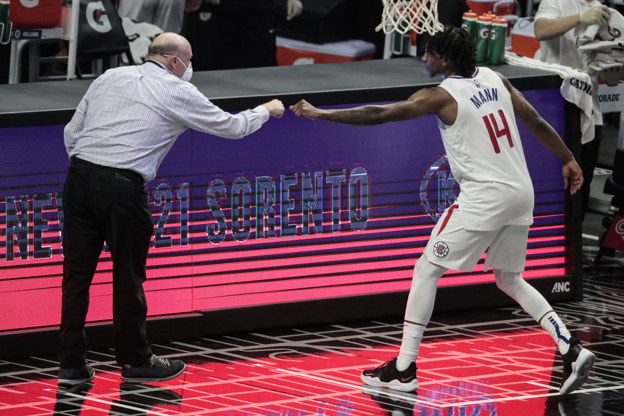 Clippers owner Steve Ballmer fist-bumps Terance Mann after a win.