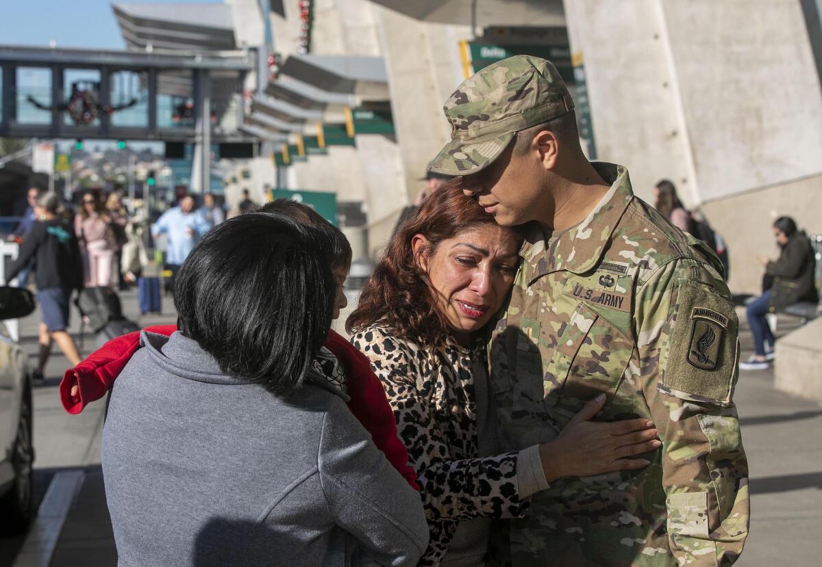 Rocio Rebollar Gomez hugs her 30-year-old son 2nd Lt. Gibram Cruz after he arrived at San Diego International Airport on Thursday, Dec. 18, 2019. Gomez is facing a January 2, 2020 date to report to the border to comply with a deportation order. This could be the last time Cruz sees her in the United States unless a legislative or administrative miracle comes through.