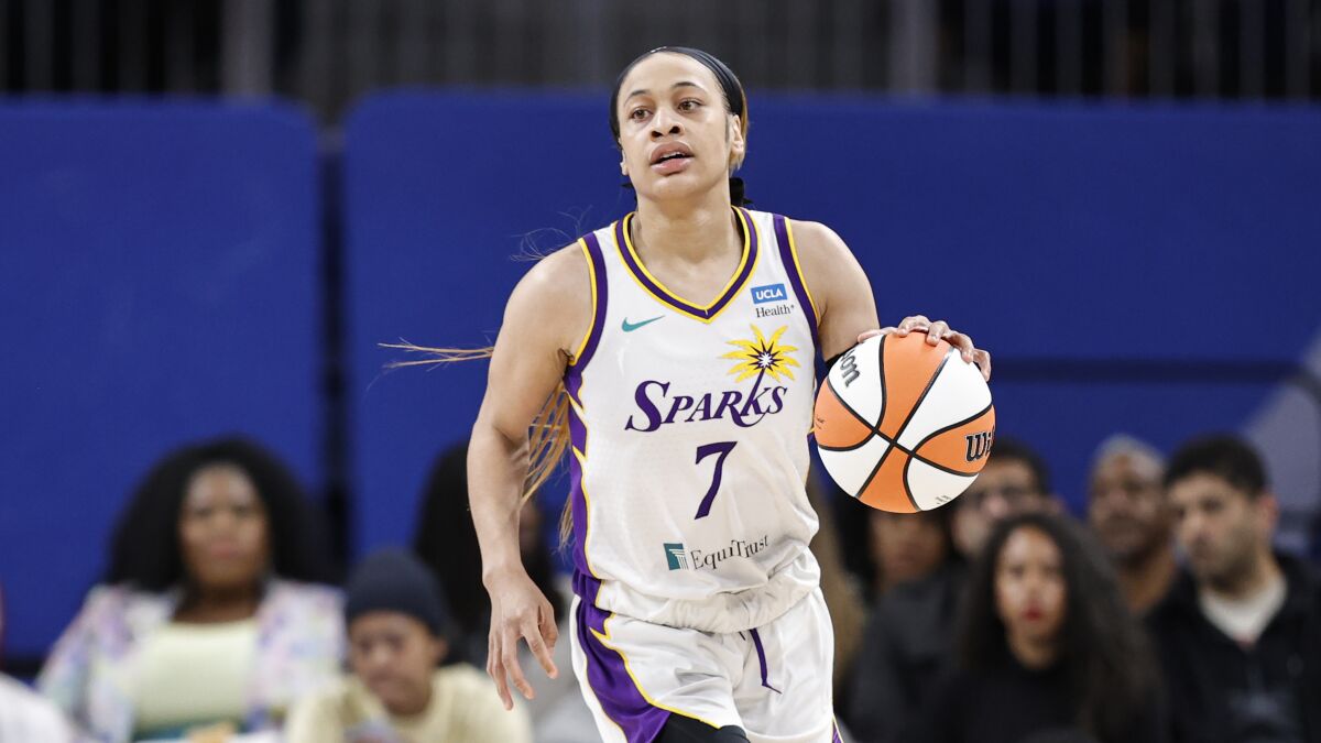 Sparks guard Chennedy Carter brings the ball up court against the Chicago Sky.