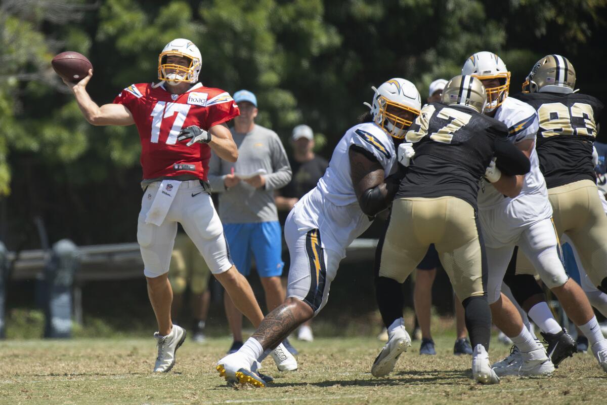 Chargers quarterback Philip Rivers throws a pass during the team's joint practice with the New Orleans Saints in Costa Mesa on Thursday.