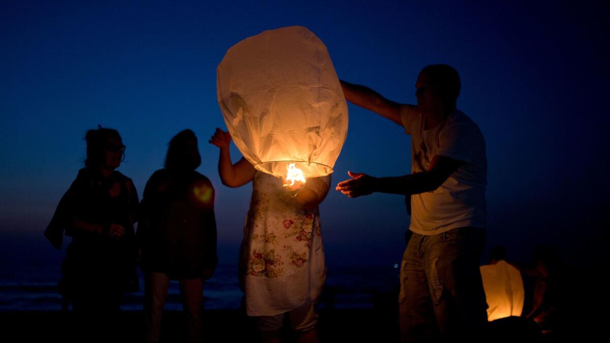Activists release paper lanterns in solidarity with Palestinians from Gaza, at the Ashkelon beach, Israel, on Monday.