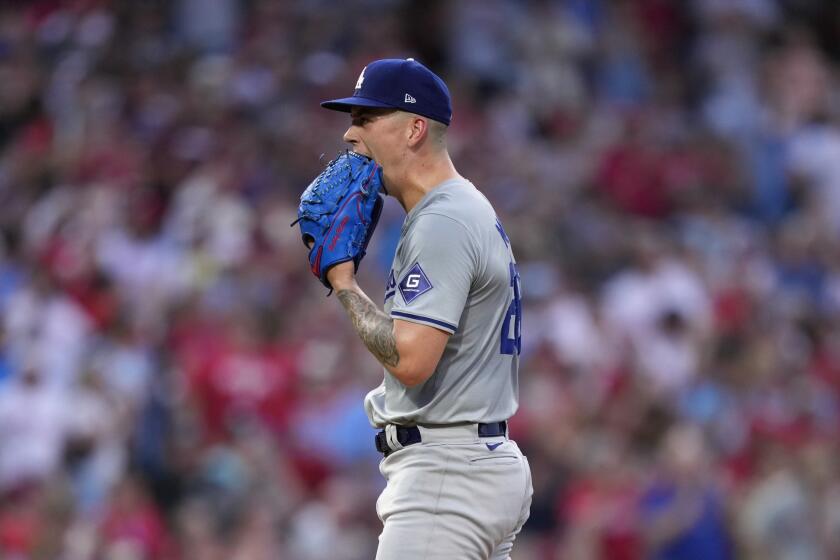Los Angeles Dodgers pitcher Bobby Miller reacts after giving up a home run to Philadelphia Phillies' Bryson Stott during the fourth inning of a baseball game, Tuesday, July 9, 2024, in Philadelphia. (AP Photo/Matt Slocum)