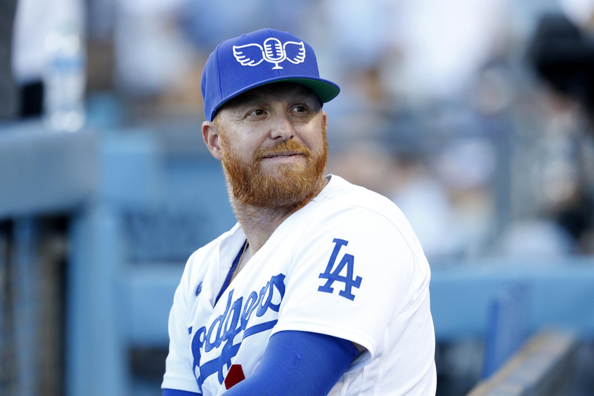 Dodgers third baseman Justin Turner wears a cap paying tribute to legendary broadcaster Vin Scully.