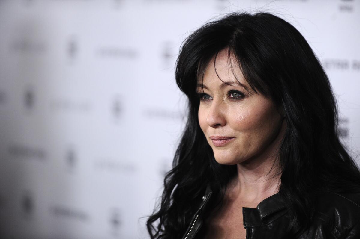 Shannen Doherty looks away from camera