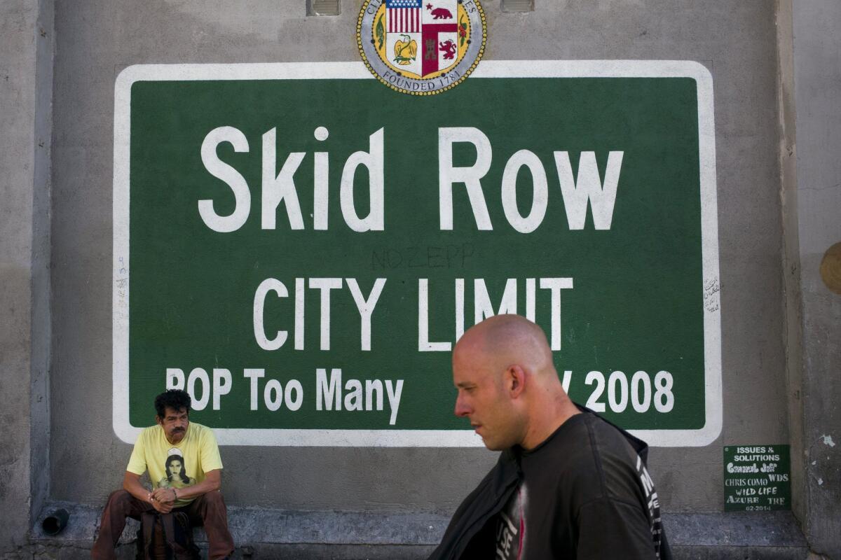 A sign on L.A.'s skid row, where tenants of a residential hotel have sued the owner, alleging that he is trying to force them out.