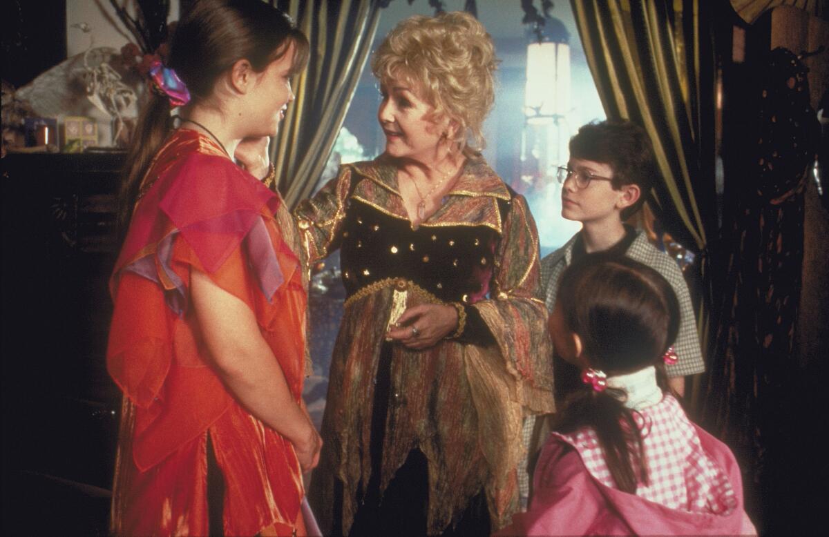 Kimberly J. Brown, Debbie Reynolds, Joey Zimmerman and Emily Roeske in a scene from "Halloweentown."