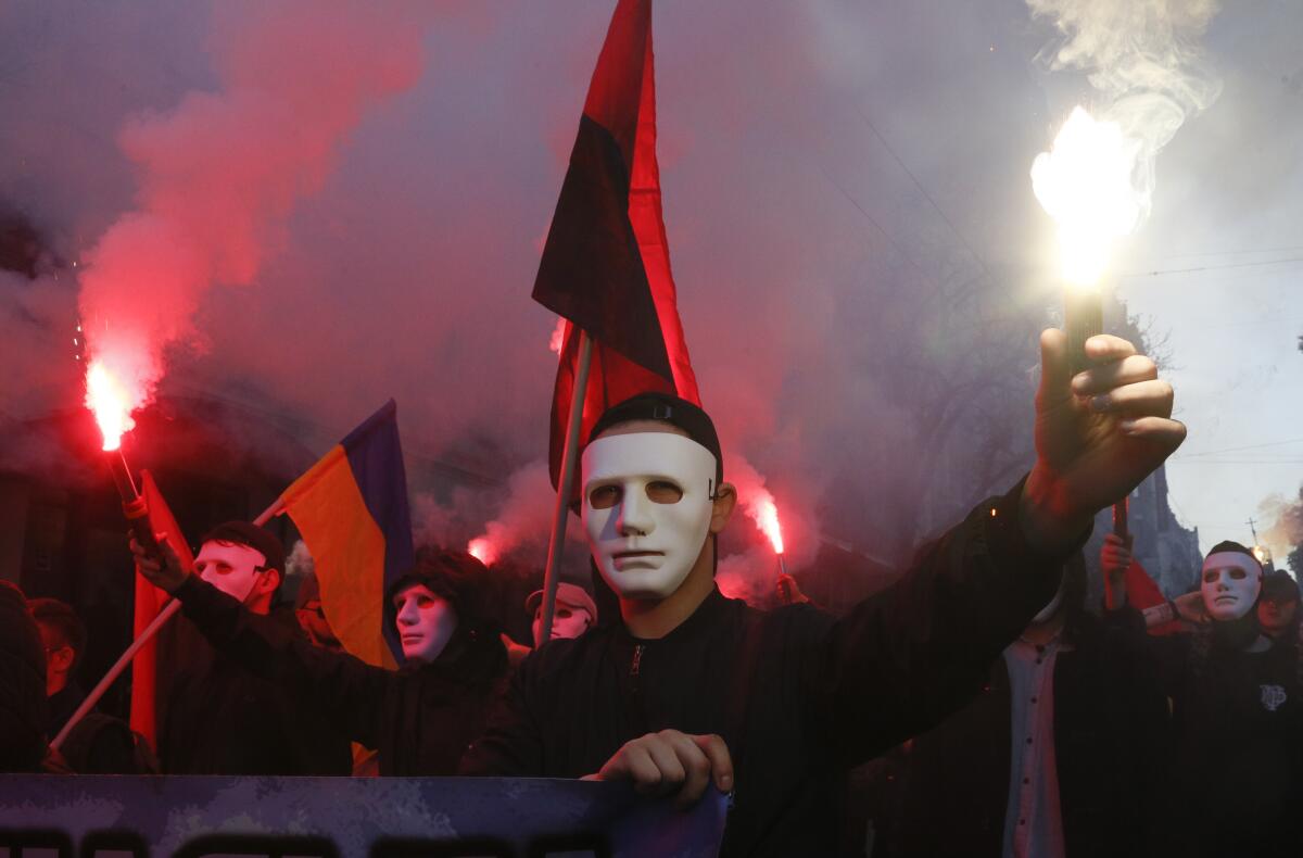 Some 15,000 far-right and nationalist activists protest in the Ukrainian capital on Monday, chanting "Glory to Ukraine" and waving the Ukranian flag.