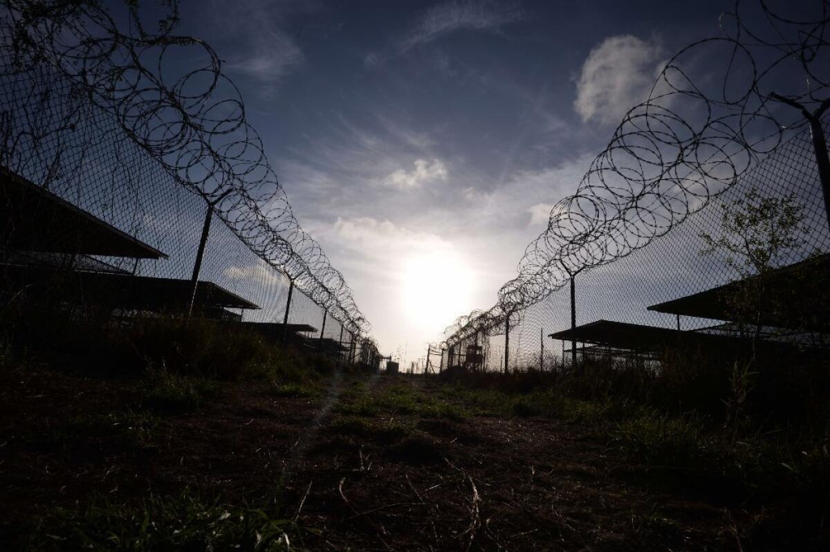 The razor wire-topped fence at the now-closed Camp X-Ray detention facility at the U.S. naval base at Guantanamo Bay, Cuba.