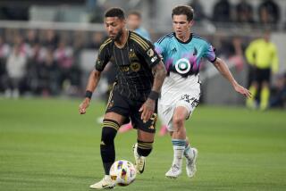Minnesota United midfielder Will Trapp, right, chases Los Angeles FC forward Denis Bouanga.