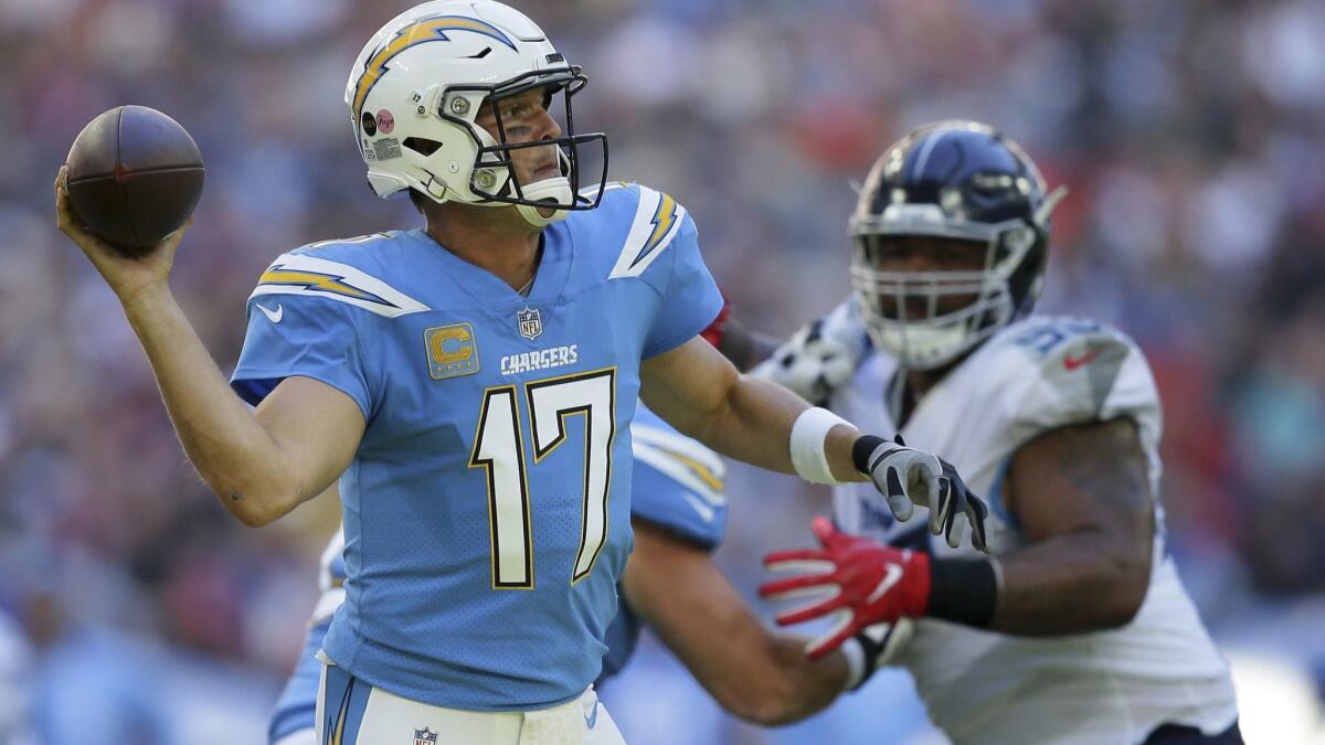 In this Oct. 21, 2018, file photo, Los Angeles Chargers quarterback Philip Rivers (17) passes the ball during the first half of an NFL football game against the Tennessee Titans, at Wembley stadium in London.