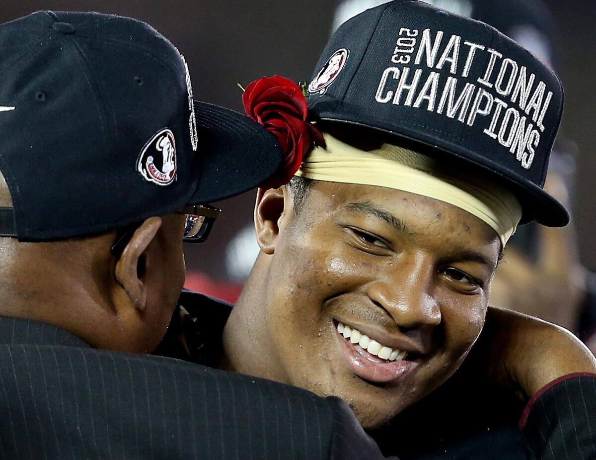 Florida State quarterback Jameis Winston is congratulated after leading the Seminoles to a last-minute victory over Auburn in the BCS national championship game on Monday night at the Rose Bowl in Pasadena.