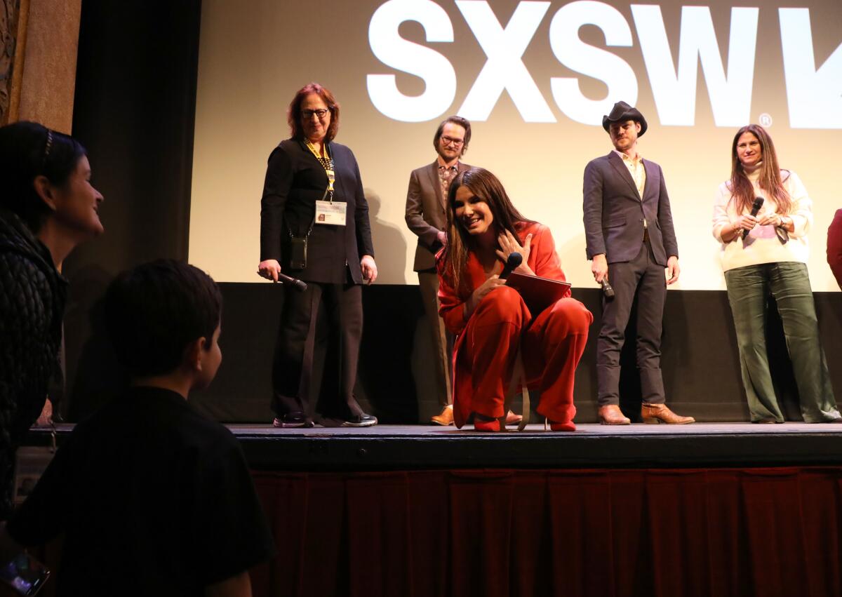 Sandra Bullock speaks to a fan at the SXSW Film Festival
