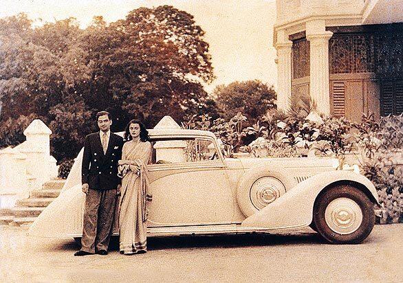 Devi poses next to a custom-built Rolls-Royce in this undated photo taken in Jaipur. The death of Devi, who personified a lost era of aristocratic privilege and exotic glamour in India, has sparked a bitter inheritance dispute among her heirs.