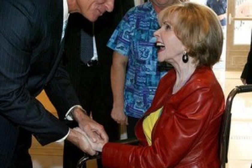 Paula Hawkins greets Florida Gov. Charlie Crist at an event in Orlando in October. As a U.S. senator in the 1980s, Hawkins helped pass the Missing Children Act and revealed at a Congressional hearing that she had been molested as a child.