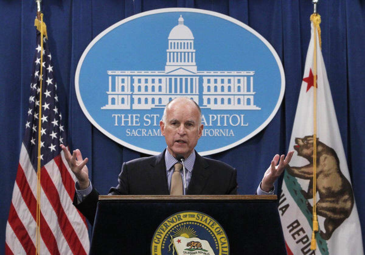 Gov. Jerry Brown responds to a question concerning his revised 2013-14 state budget plan during a news conference at the Capitol in Sacramento on Tuesday.