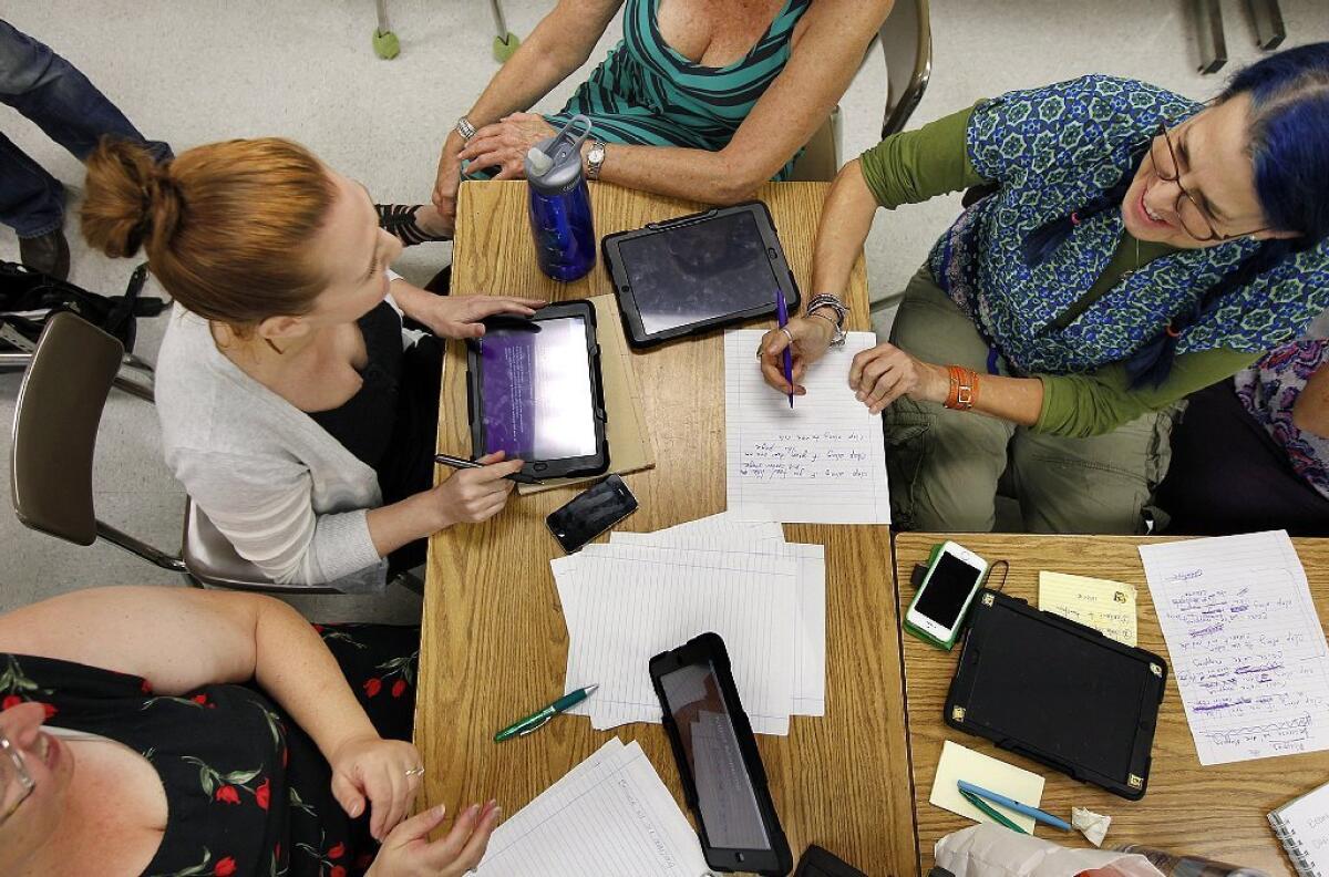 Four LAUSD teachers attend a training session in July to improve their skills at using technology in the classroom.