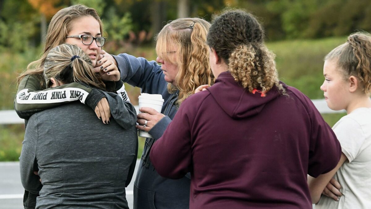 Friends of those who died in Saturday's limousine crash comfort one another on Sunday.
