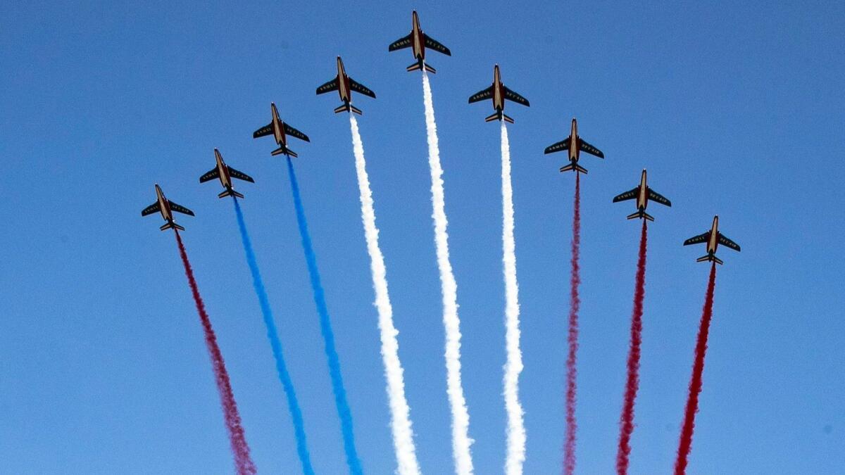 An error occurred when one of the Alpha jets flying over the Paris Bastille Day parade sprayed an extra line of red smoke, instead of blue.