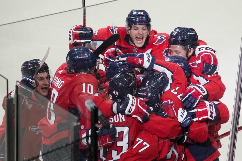 The Washington Capitals celebrate their overtime win over the Boston Bruins in Game 1 of their playoff series May 15, 2021.