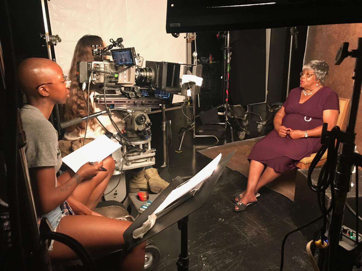 Filmmaker Oge Egbuonu and interview subject Cora Matthews during production of the documentary '(In)visible Portraits."