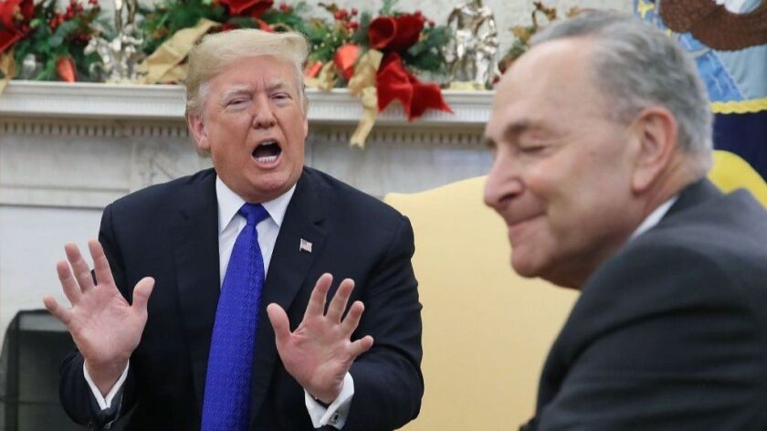 President Trump argues about border security and a possible government shutdown with Senate Minority Leader Charles E. Schumer at the White House on Dec. 11.