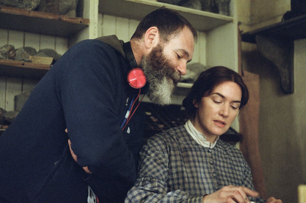 Writer-director Francis Lee and actress Kate Winslet on the set of "Ammonite."
