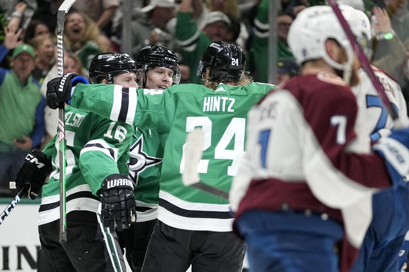 Dallas Stars' Joe Pavelski (16), Miro Heiskanen, rear, and Roope Hintz (24) celebrate a goal by Heiskanen, as Colorado Avlanches's Devon Toews (7) skates to the bench during the first period in Game 2 of an NHL hockey Stanley Cup second-round playoff series in Dallas, Thursday, May 9, 2024. (AP Photo/Tony Gutierrez)