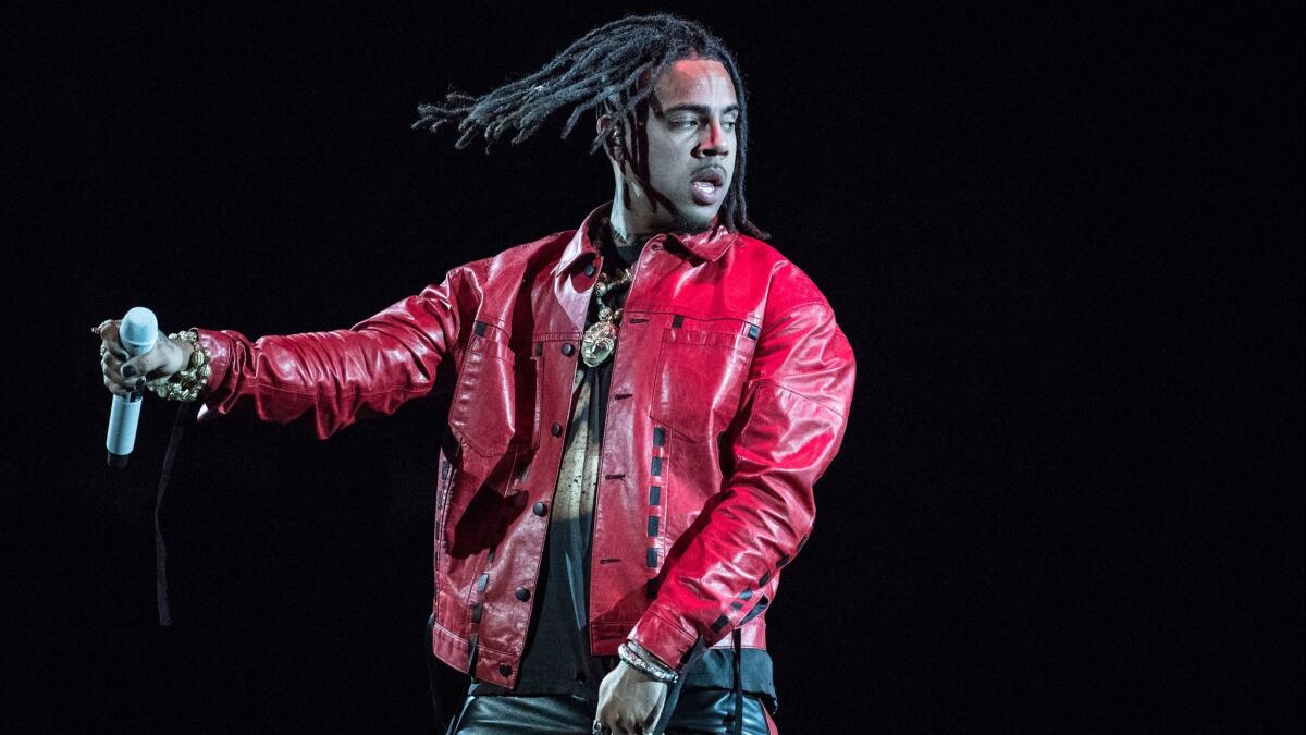 Rapper Vic Mensa on stage at the Forum in Inglewood, Dec. 21, 2017.