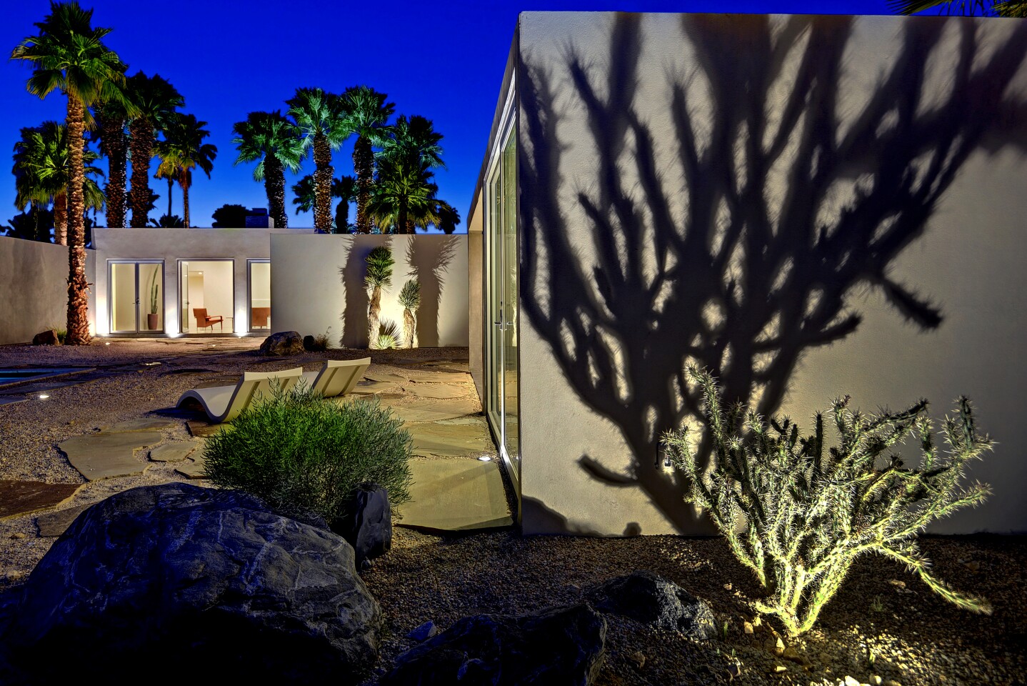 EXTERIOR RIGHT AFTER Architectural plans for the house that included ample overhangs –– a staple of classic midcentury design –– were nixed in order to hew to Frey’s intent: spartan boxes dropped onto a desertscape.