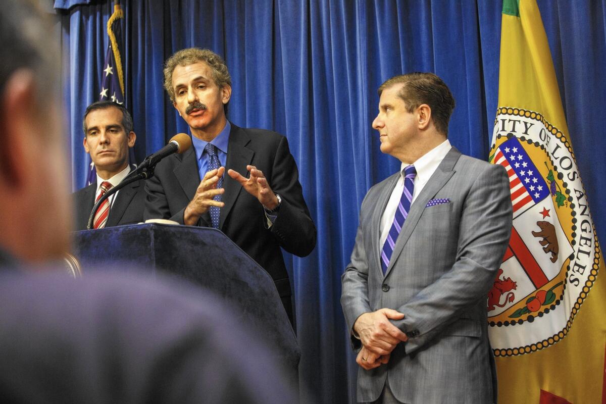 Los Angeles City Attorney Mike Feuer speaks at a May news conference. City prosecutors have long resorted to legal action to stymie gang activity.