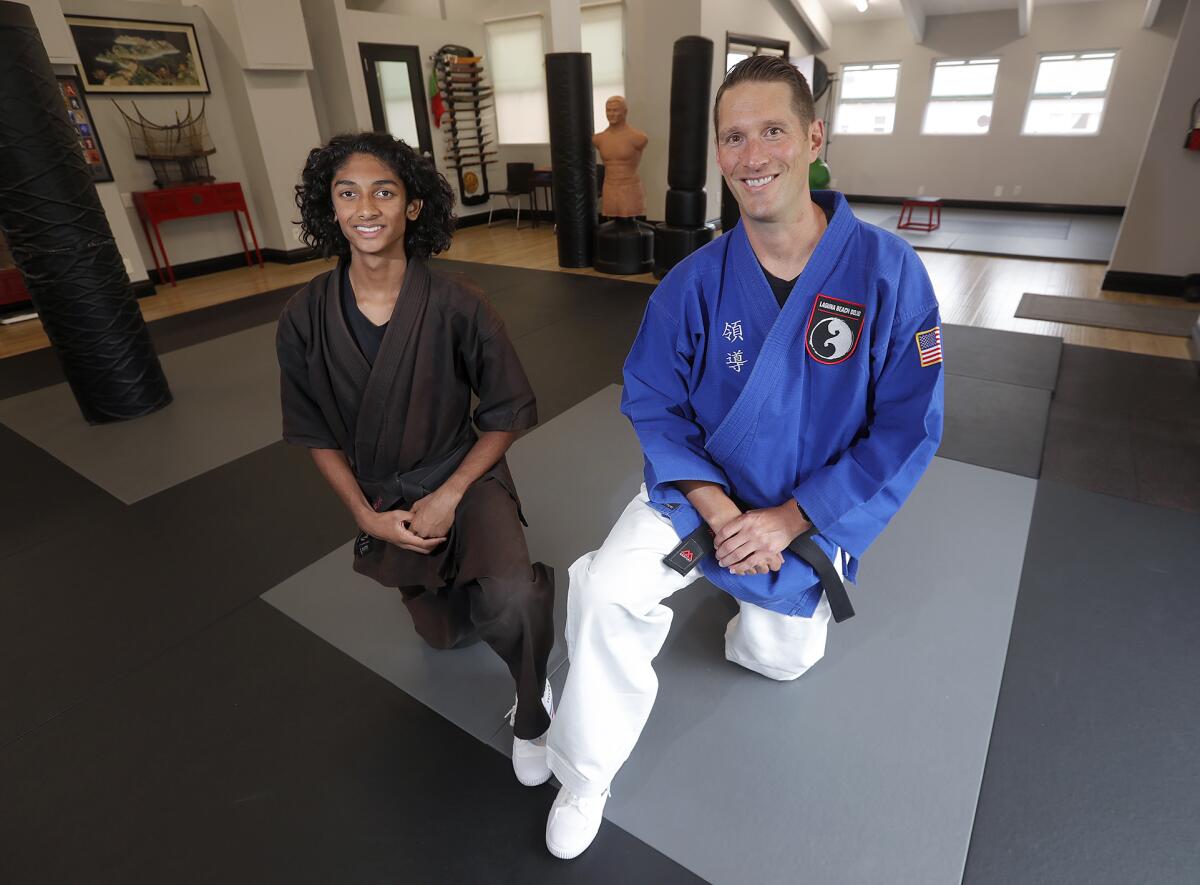 Master Jeff Kash, right, works with star student Loki Matsukhani 