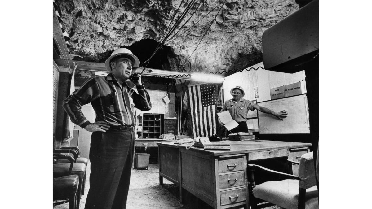 two men in an underground fallout shelter