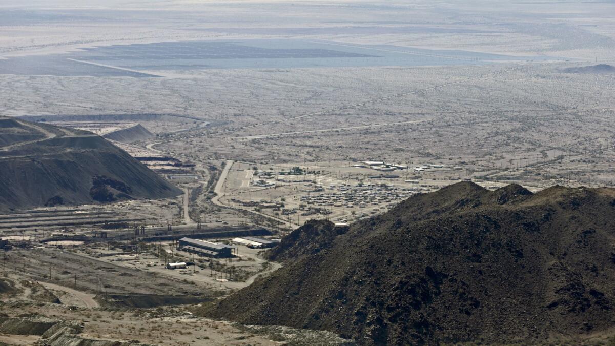 A view of the lower portion of the Eagle Mountain mine site and abandoned company town. A large solar farm is in the distance. (Irfan Khan / Los Angeles Times)