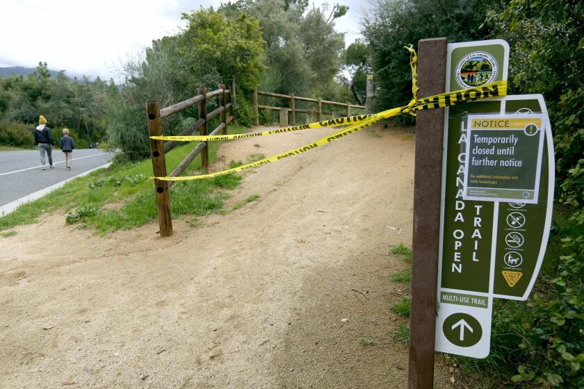 The La Canada Open Space Trail is now closed until further notice, due to the novel coronavirus COVID-19 restrictions, in La Canada Flintridge on Tuesday, March 24, 2020. Some walkers who came upon the closure were in disbelief.