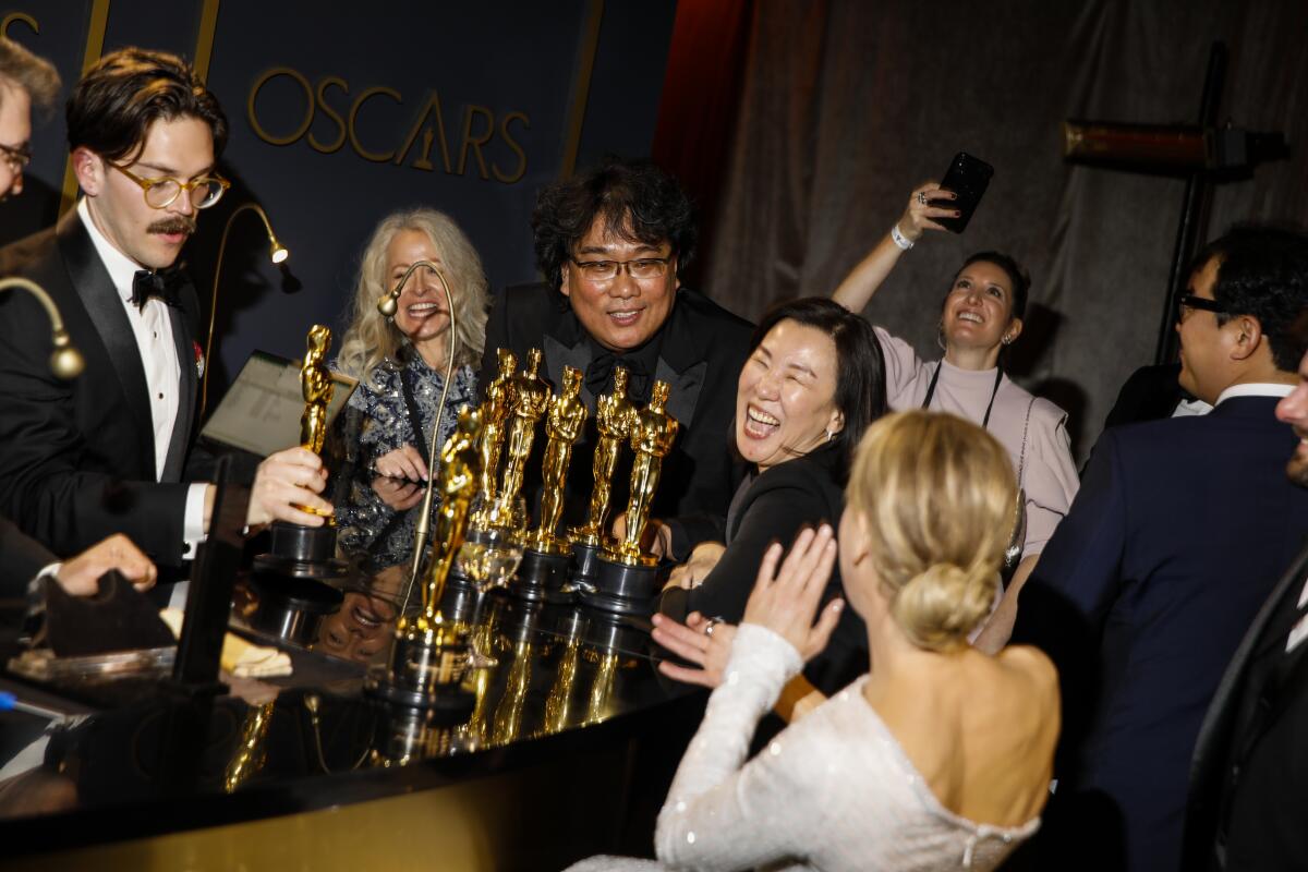 Bong Joon Ho, winner of the director, original screenplay and best picture Oscars for “Parasite,” and Renée Zellweger, winner of the lead actress Oscar for “Judy,” at the Academy Awards Governors Ball.