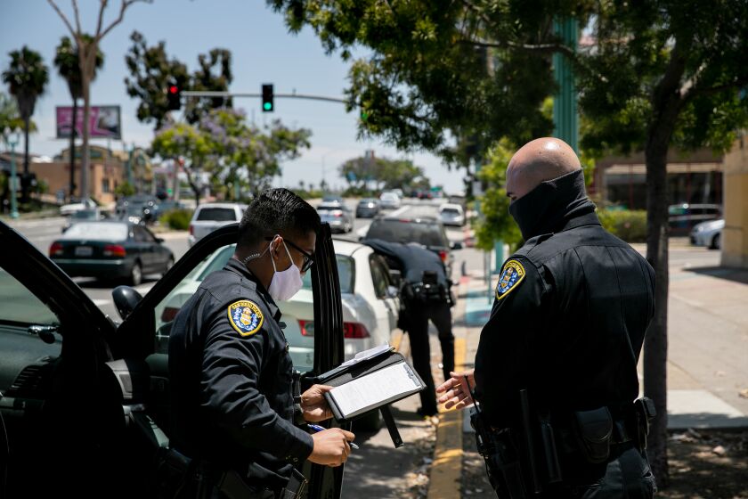 San Diego Police Department officers make a traffic stop along El Cajon Boulevard on June 23, 2020 in San Diego, California.