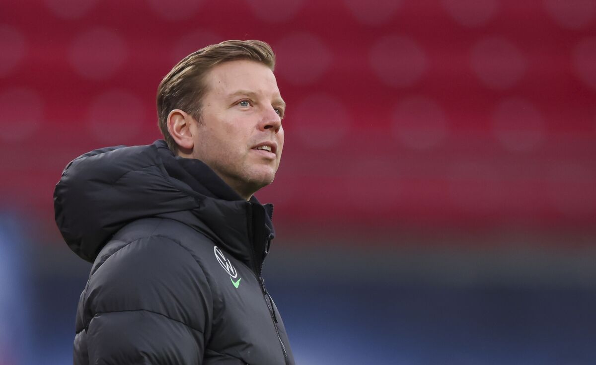 FILE - Wolfsburg's coach Florian Kohfeldt stands in the stadium before the Bundesliga soccer match between RB Leipzig and VfL Wolfsburg in Leipzig, Germany, on Jan. 23, 2022. Wolfsburg is banking on a victory against last-place Greuther Fürth on Sunday after failing to win any of its last nine Bundesliga games. Anything less could spell the end for coach Florian Kohfeldt and leave Wolfsburg contemplating relegation in a season that started with Champions League soccer. (Jan Woitas/dpa via AP)