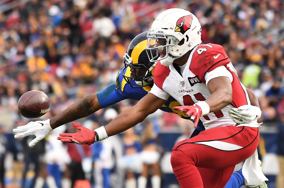 Rams linebacker Cory Littleton prevents Arizona Cardinals running back Kenyan Drake from making a catch.
