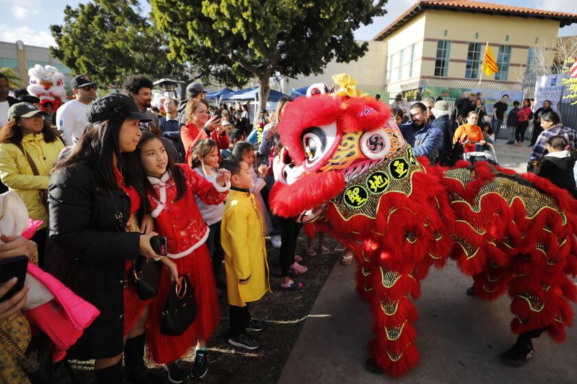San Diego, CA - January 22: Performers from Southern Sea Dragon and Lion Dance entertain the crowd at the SD Lunar New Year Festival in City Heights on Sunday, January 22, 2023. The three-day festival at Officer Jeremy Henwood Memorial Park included traditional food and performances, arts and cultural exhibits. (K.C. Alfred / The San Diego Union-Tribune)