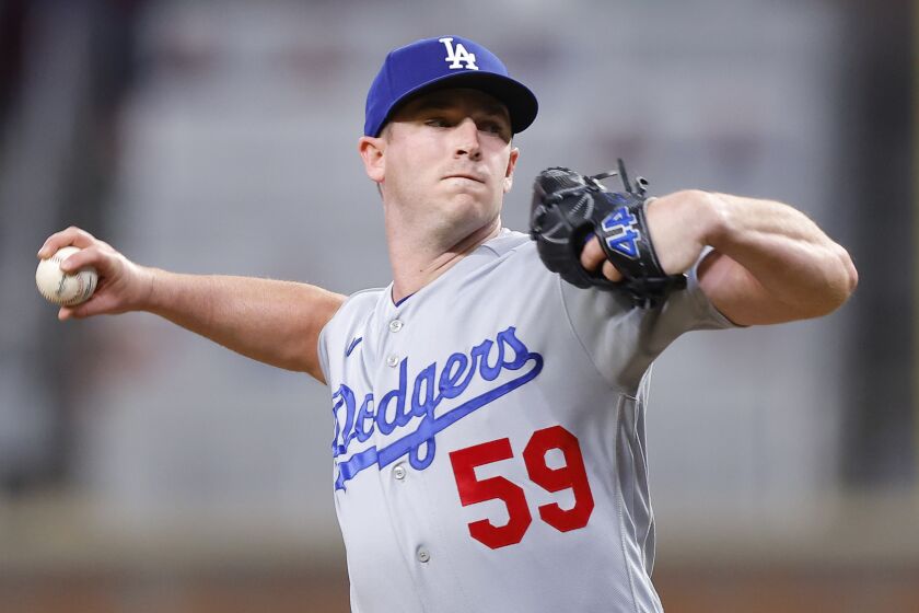 Dodgers reliever Evan Phillips works against the Atlanta Braves at Truist Park on May 23, 2023 in Atlanta.