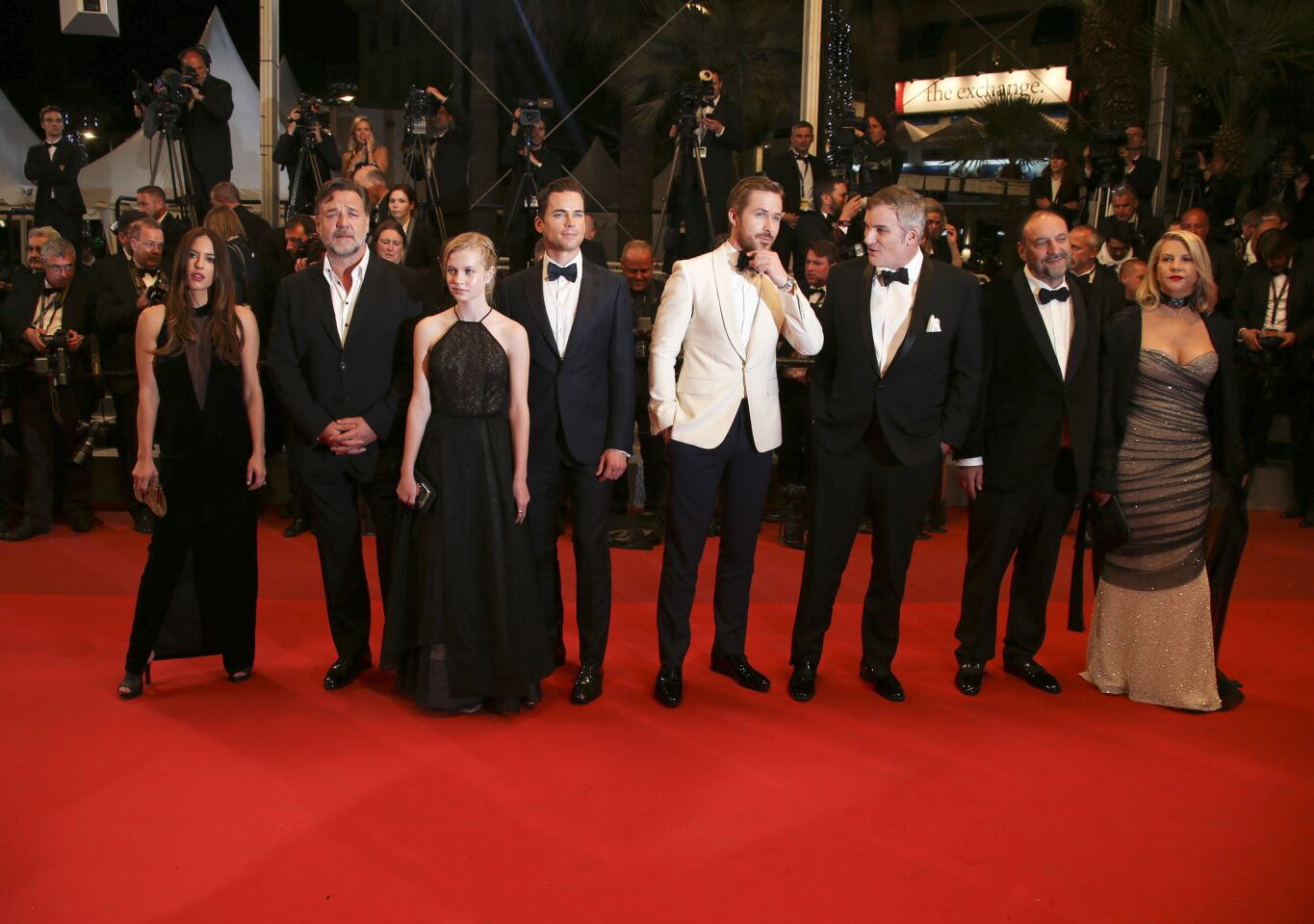 Actors Murielle Telio, left, actor Russell Crowe, actress Angourie Rice, actor Matt Bomer, actor Ryan Gosling, director Shane Black and producer Joel Silver pose upon arrival at the screening of the film "The Nice Guys" at the 69th Cannes Film Festival.