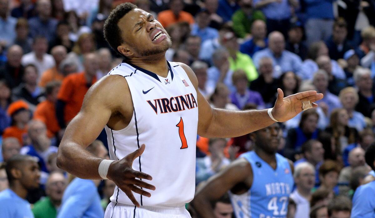 Virginia guard Justin Anderson reacts to a missed opportunity against North Carolina during their ACC tournament semifinal game Friday.