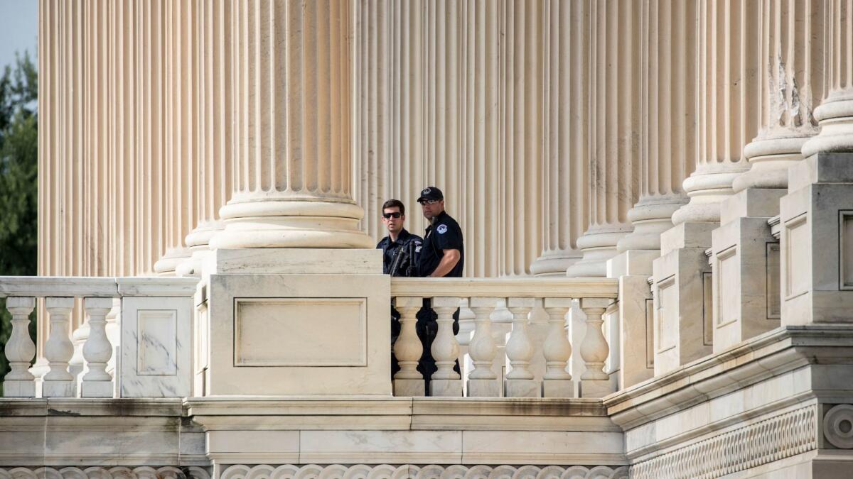 Capitol Hill Police officers stand watch outside the House of Representatives on Capitol Hill in Washington, D.C. on Thursday, June 15, 2017.