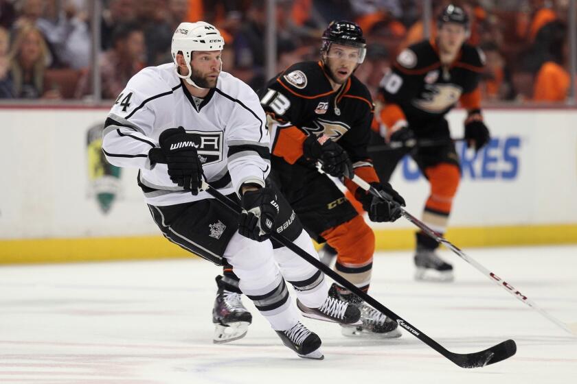 Kings defenseman Robyn Regehr is pursued by the Ducks' Nick Bonino in Game 1 of their series on May 3.