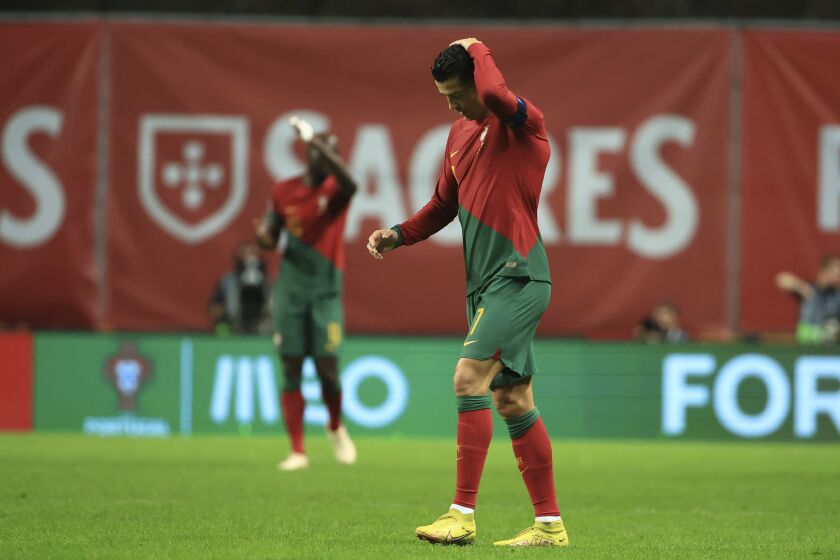 Portugal's Cristiano Ronaldo touches his head during the UEFA Nations League soccer match between Portugal and Spain at the Municipal Stadium in Braga, Portugal, Tuesday, Sept. 27, 2022. (AP Photo/Luis Vieira)