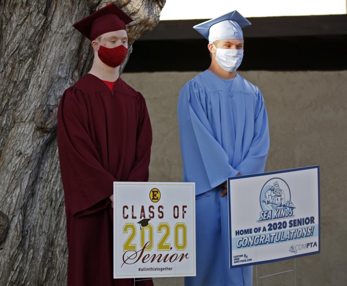 Estancia High School senior Marcus Winters, left, and his friend Zeke Eampietro, from Corona del Mar High, pose for photos.